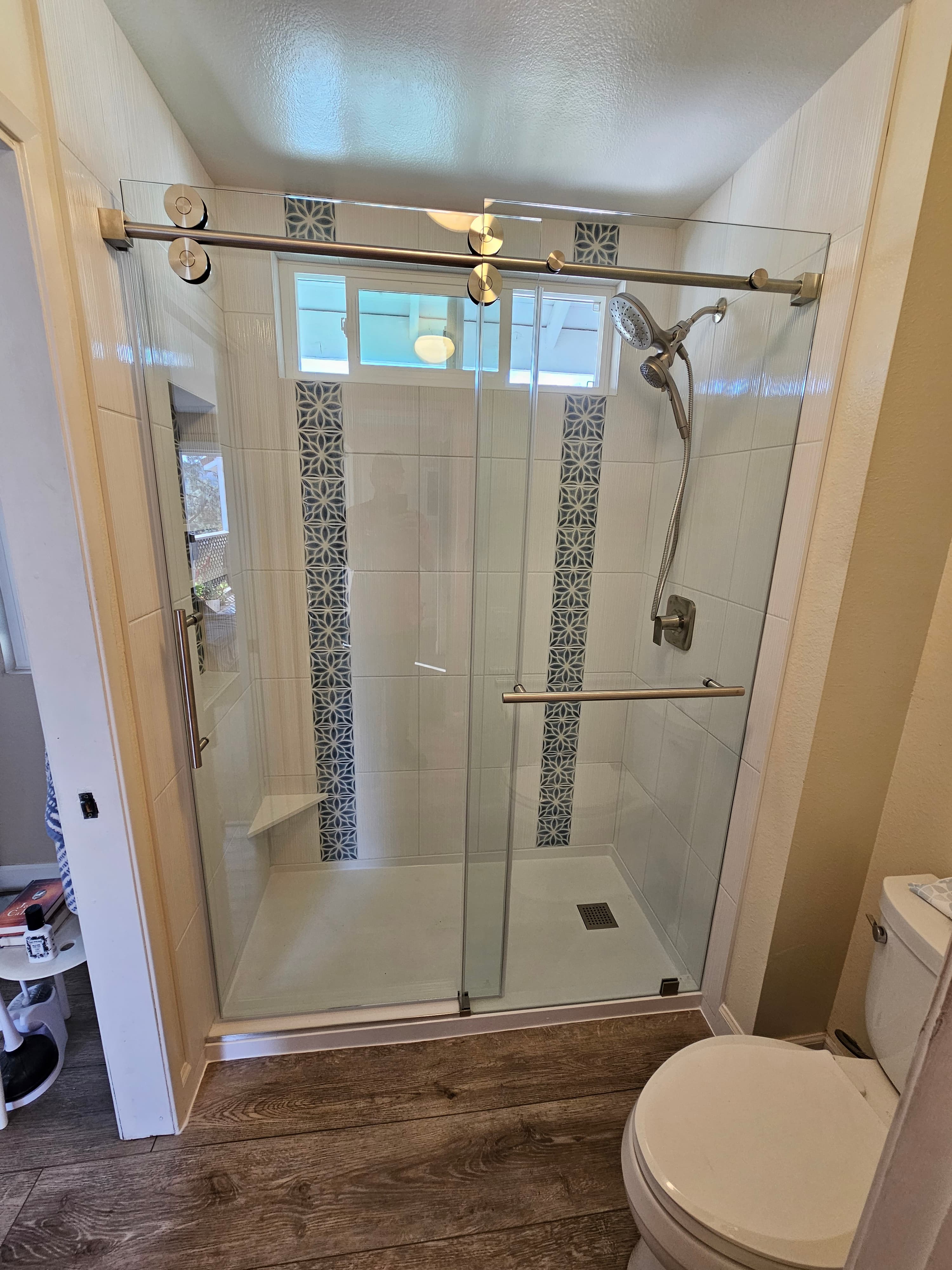 Luxury Mission Viejo shower surround with marble tile and geometric border detail