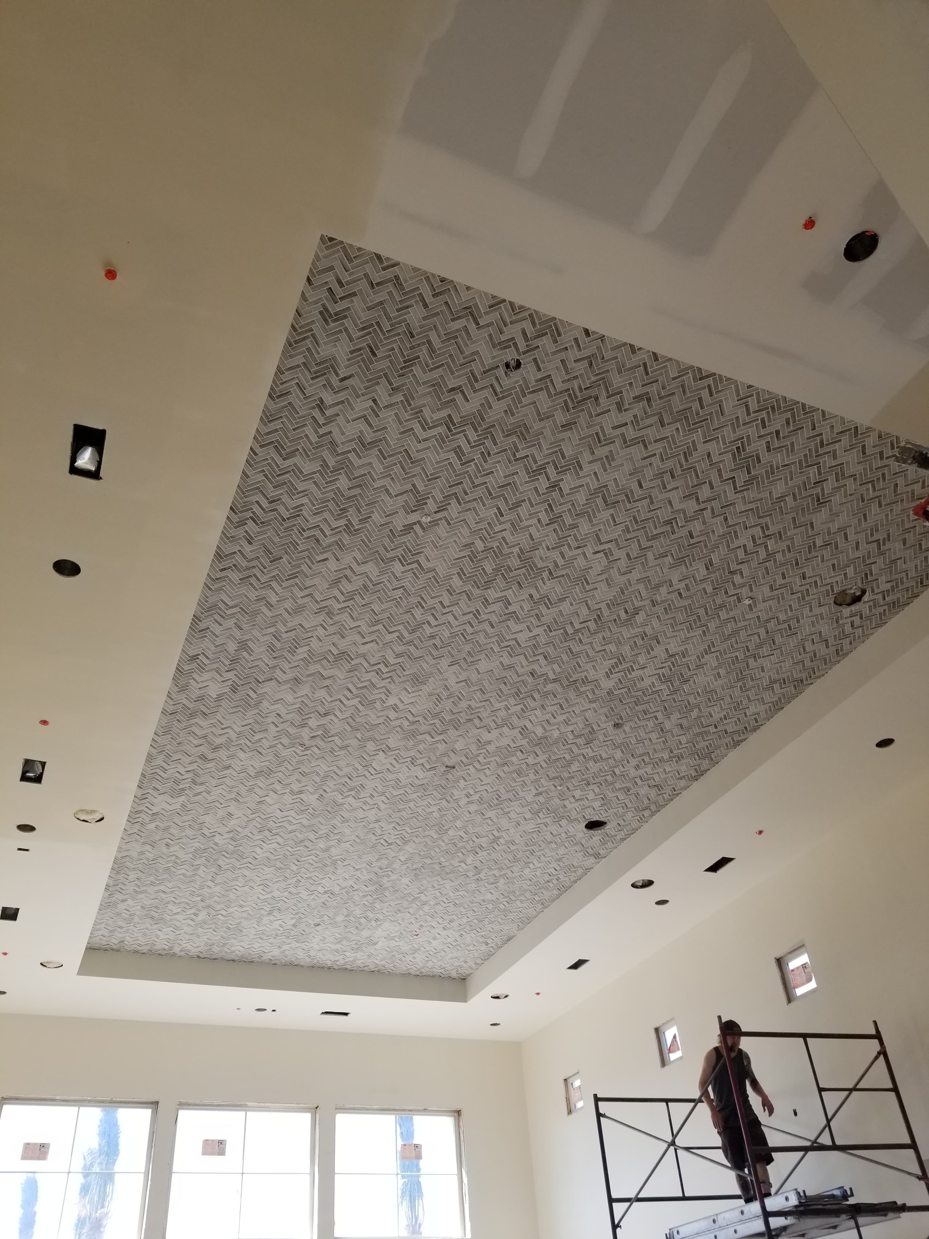Large herringbone tile feature wall installation in Ontario commercial space